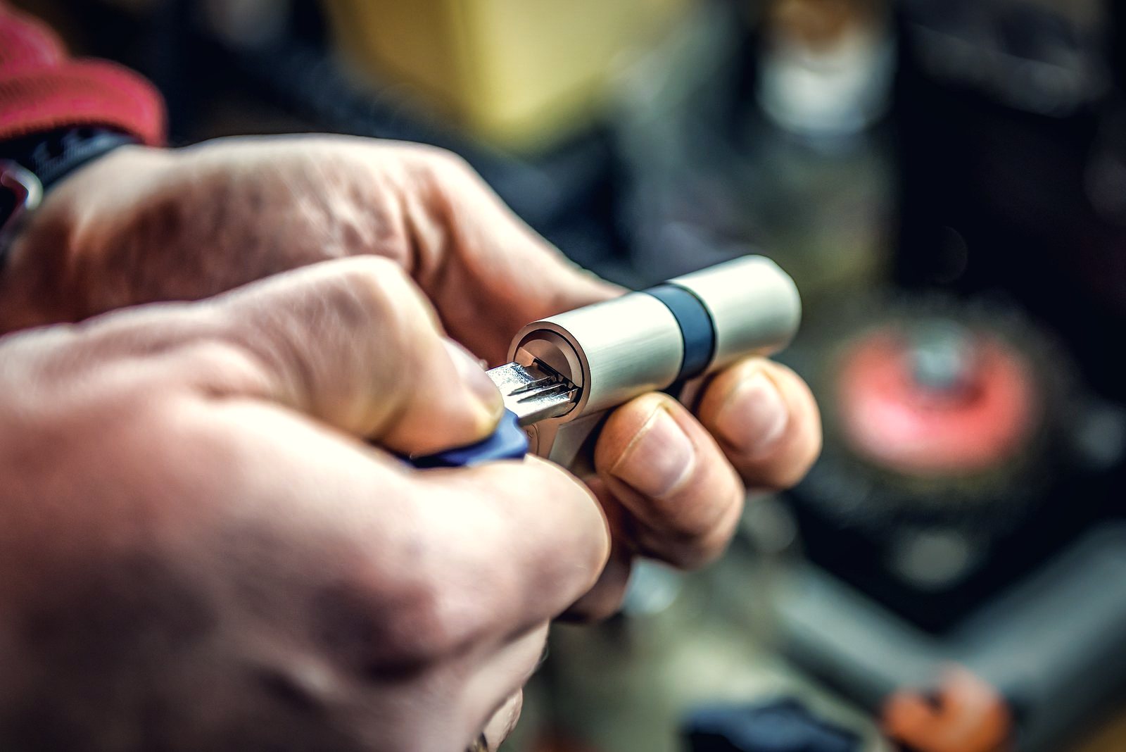 Locksmith fitting a key into a euro cylinder lock